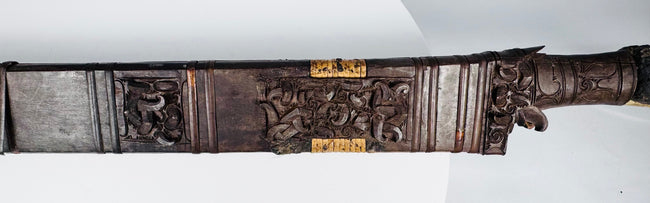Detail of Mandau scabbard showing openwork ornament and contrasting applied elements
