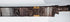 Detail of Mandau scabbard showing openwork ornament and contrasting applied elements