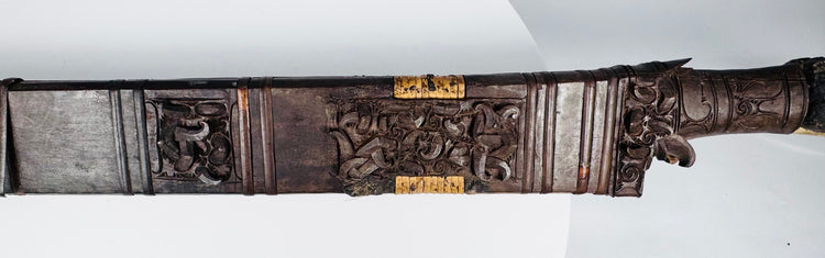 Detail of Mandau scabbard showing openwork ornament and contrasting applied elements
