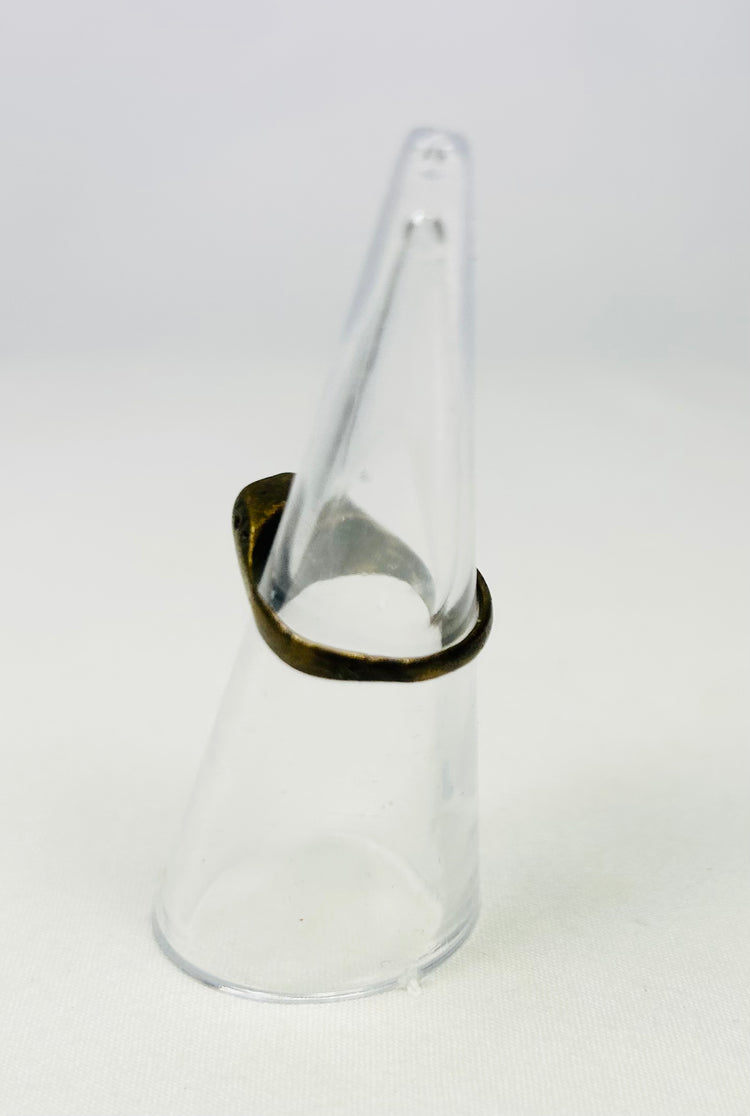 Archaeological brass ring with patinated surface
