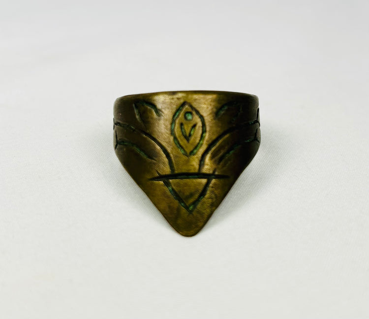 Ancient brass thumb guard with engraved motifs