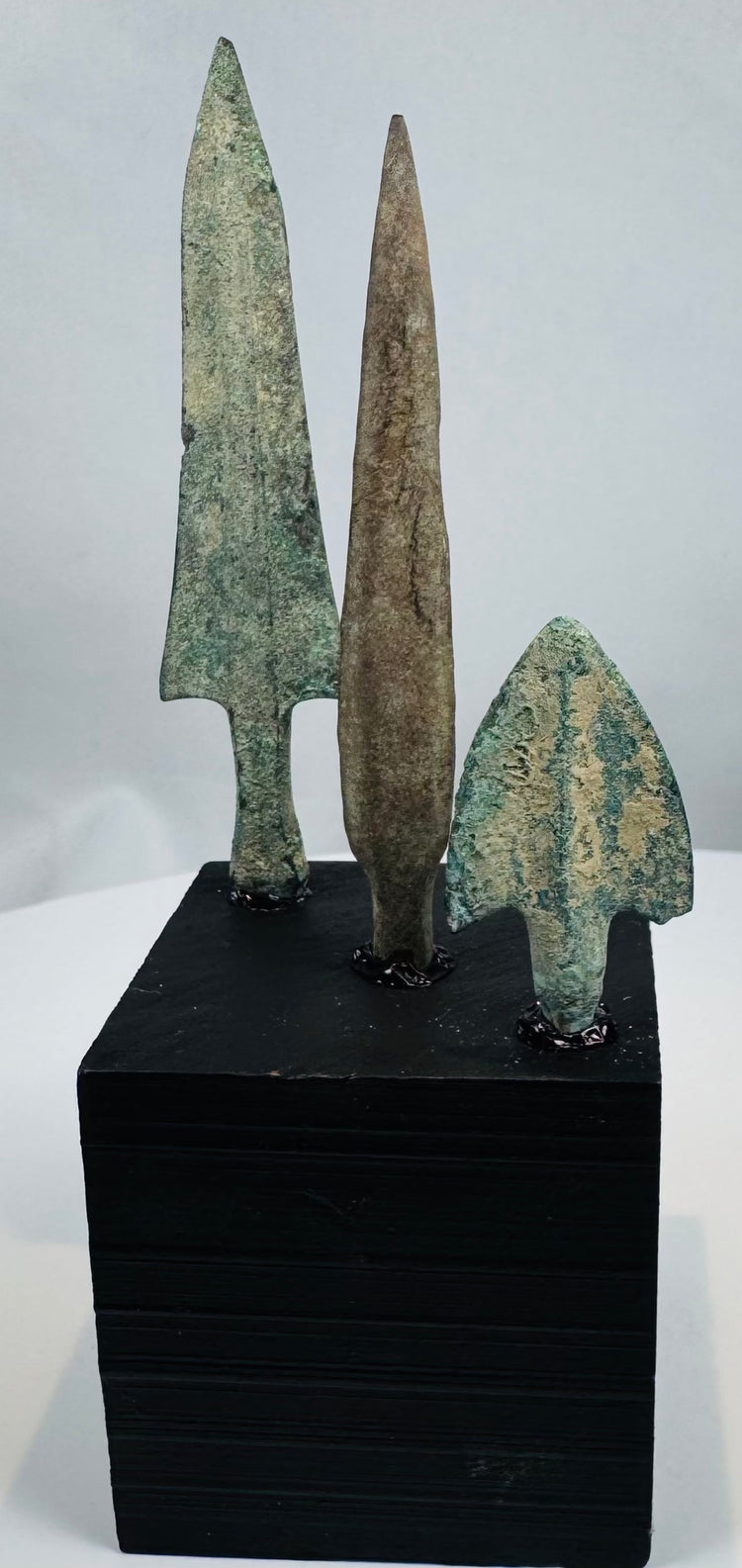 Mounted group of ancient bronze arrowheads dating to the 14th–10th century BCE