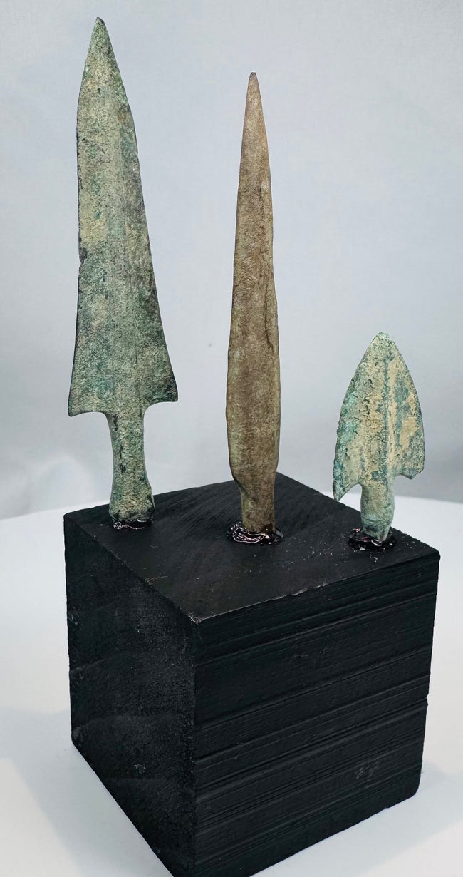 Long narrow lanceolate bronze arrowhead with brown mineral patination