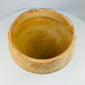 Close-up of Bronze Age terracotta bowl highlighting handmade irregularities