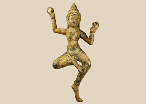 Bronze South Asian sculpture of a dancing deity, likely a Devata or Apsara, with ornate headpiece, flowing attire, and natural green patina, circa 12th–18th century CE.