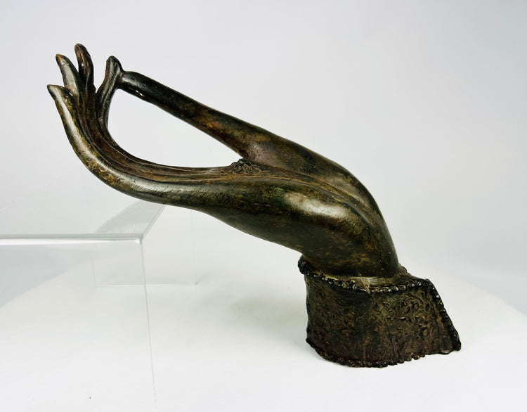 Southeast Asian bronze Buddha hand, Ayutthaya to early Rattanakosin period, open palm with rosette symbol.