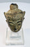 Historic crowned Buddha head with arched brows, closed eyes, subtle smile, and ornate crown band