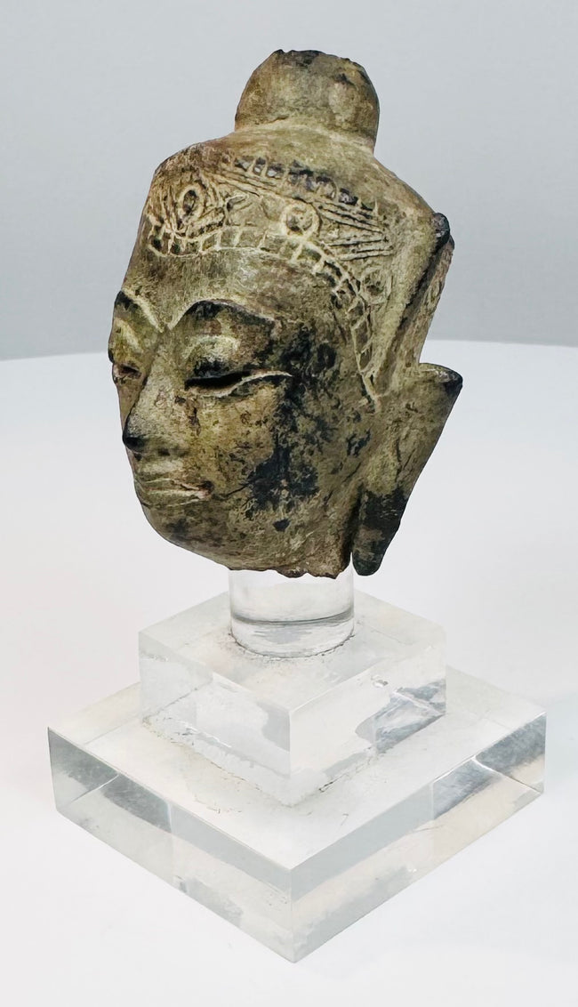 Theravada Buddhist bronze head from Thailand or Burma with natural patina and ritual wear