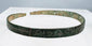 Ancient zoomorphic bronze bracelet with green, blue-green, brown, and earthen deposits