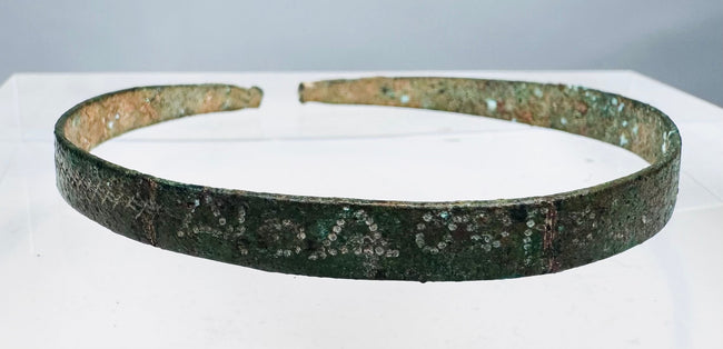 First-millennium BCE bronze bracelet with incised geometric decoration and green patina