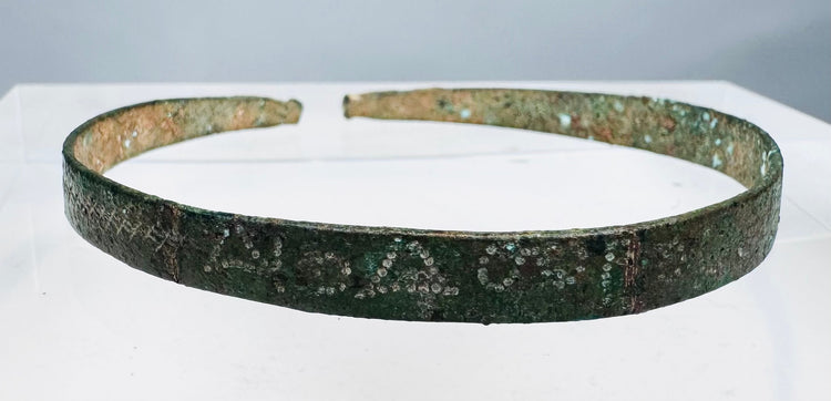 First-millennium BCE bronze bracelet with incised geometric decoration and green patina