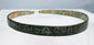 First-millennium BCE bronze bracelet with incised geometric decoration and green patina