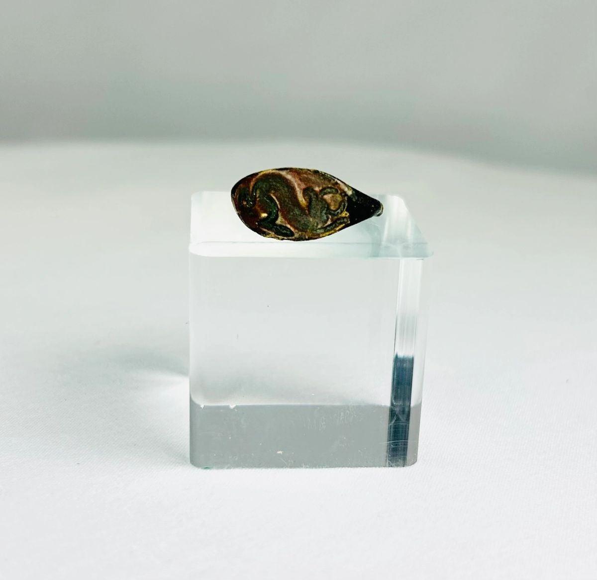 Ancient bronze ring from the Mediterranean or Near East, 1st–4th Century CE, featuring an oval bezel engraved with a horned bull symbolizing strength, power, and fertility. Natural green patina and finely detailed engraving preserve the historical artistry and cultural significance of this antiquity.