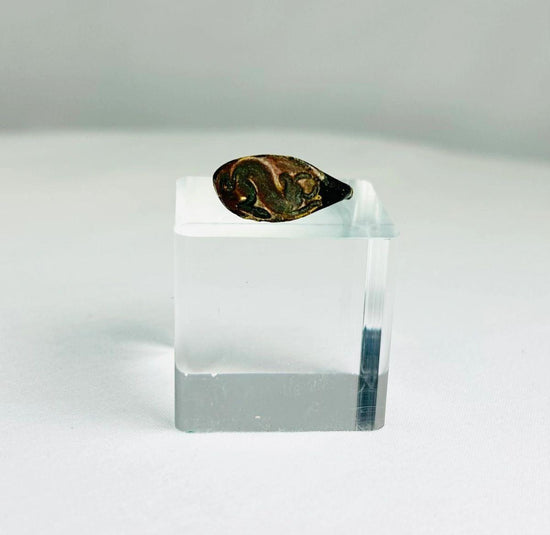 Ancient bronze ring from the Mediterranean or Near East, 1st–4th Century CE, featuring an oval bezel engraved with a horned bull symbolizing strength, power, and fertility. Natural green patina and finely detailed engraving preserve the historical artistry and cultural significance of this antiquity.