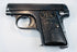 FN Browning Model 1906 Triple Safety variant with an enlarged manual safety lever, slide serrations, and checkered grips.