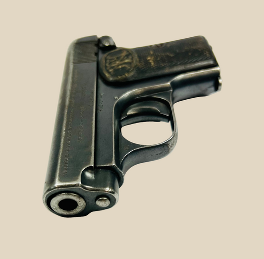 Browning FN Model 1906 pocket pistol, serial #368133, Belgium, circa 1912–1914. Third-variant “Triple Safety” design with grip, manual, and magazine safeties. Early 20th-century collectible semi-automatic handgun, deactivated for safe display.