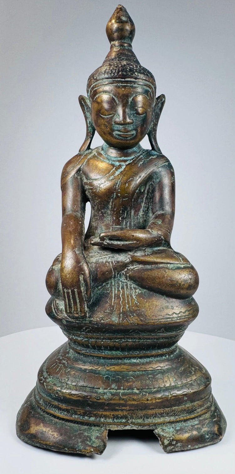Burmese Shakyamuni Buddha seated upon a lotus throne and tiered pedestal