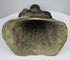 Open underside of the hollow-cast Burmese bronze Buddha with mineral deposits