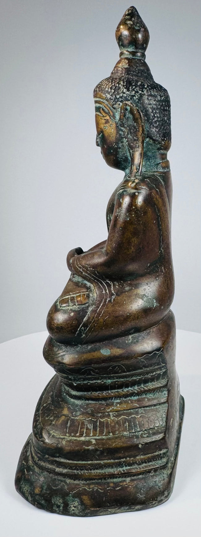 Opposite side view of the Myanmar Buddha with incised robe detailing