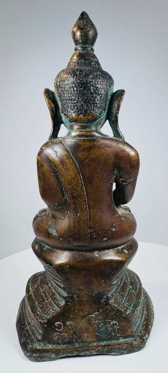 Rear view of the Burmese Buddha showing the draped monastic robe