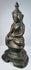 Side profile of the seated Burmese bronze Buddha and lotus-bud finial