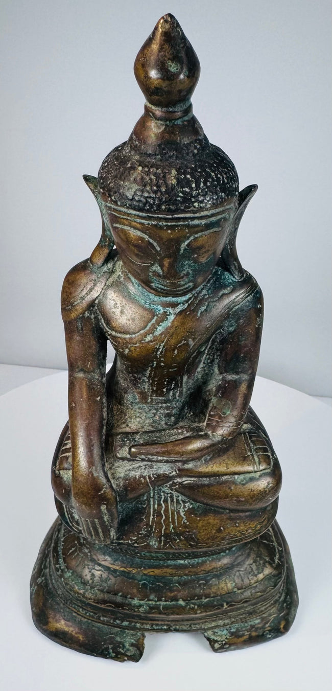 Back view of the antique Burmese Buddha and decorated stepped pedestal