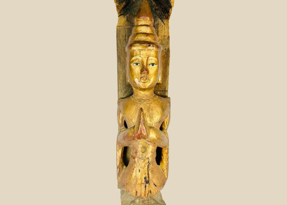 Monumental 45-inch Burmese temple finial, late 19th–early 20th century, carved hardwood with gilded Buddha in Anjali Mudra and spire form, retaining aged patina.