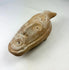 Ancient Byzantine terracotta lamp with detailed human facial spout