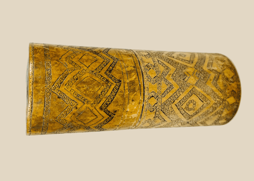 Antique carved bamboo container from Island Southeast Asia, 19th century, cylindrical with fitted lid and base, decorated with incised geometric patterns darkened with pigment, traditionally used for betel nut lime storage, photographed on a white background.