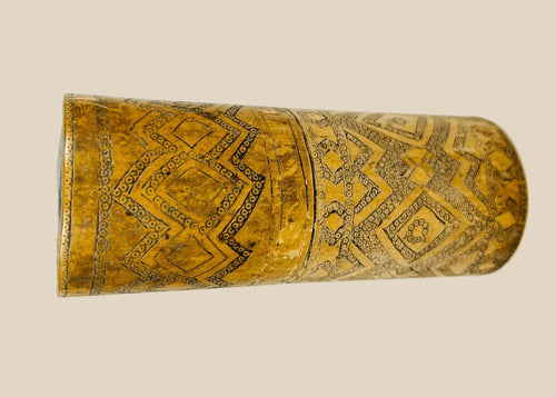 Antique carved bamboo container from Island Southeast Asia, 19th century, cylindrical with fitted lid and base, decorated with incised geometric patterns darkened with pigment, traditionally used for betel nut lime storage, photographed on a white background.