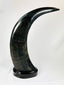 Mid-20th-century East Asian decorative horn sculptures with dragons, tigers, clouds, and black lacquered mounts