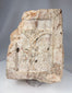 European devotional stone relief depicting Christ crucified within a niche-like architectural setting