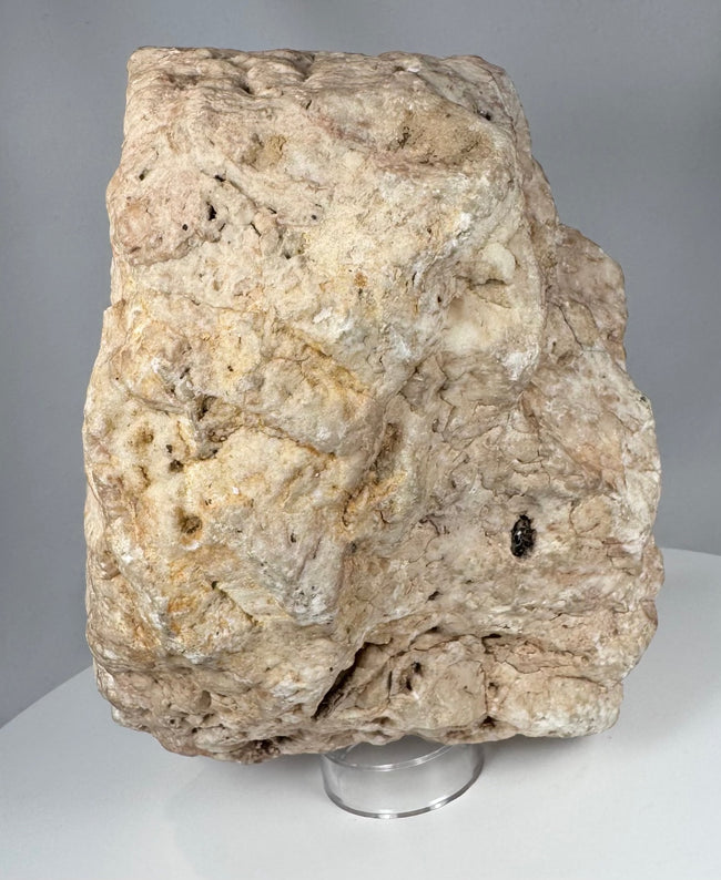 Medieval Christian stone carving fragment with weathered crucifixion imagery and devotional iconography