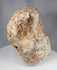 European medieval-style carved stone devotional fragment with cruciform figure and architectural background