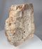 Ancient carved stone panel fragment depicting Christ on the Cross with worn medieval relief details
