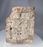 Historic European stone architectural fragment with relief carving of the Crucifixion and surrounding structures