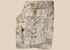 Medieval carved stone fragment depicting Christ on the Cross within an architectural niche with surrounding relief details