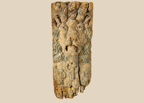 Hand-carved hardwood Baroque lion mascaron corbel with swirling mane, traces of original blue-grey paint, gesso, and parcel gilding, integral tenon and fixing holes for architectural mounting, late 17th–early 18th century, Europe, circa 1650–1750.