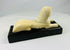 Early 1900s Egyptian revival sphinx sculpture mounted on original black wood base