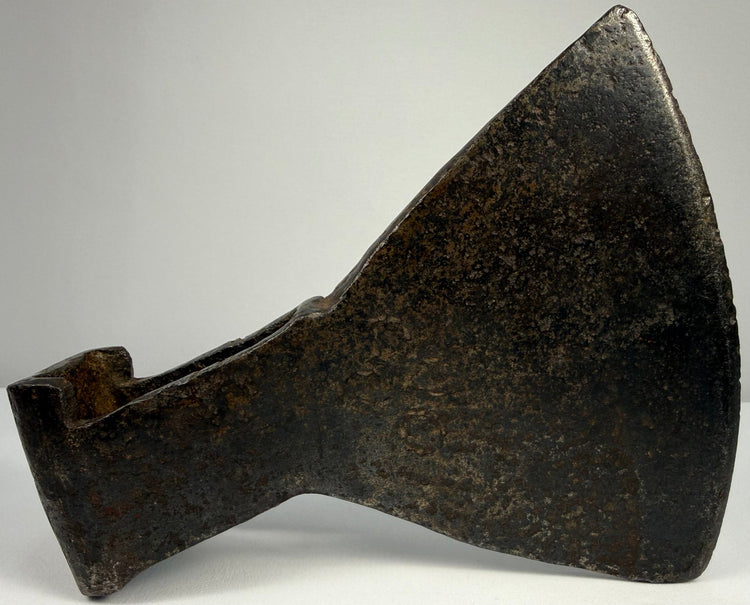 18th-century cast iron axe head from Europe or Colonial America with broad trapezoidal blade