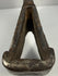 Heavy 18th-century cast iron axe head with oxidized patina and indistinct punched motif