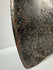 Early cast iron axe head with broad splitting blade, triangular socket, and weathered surface