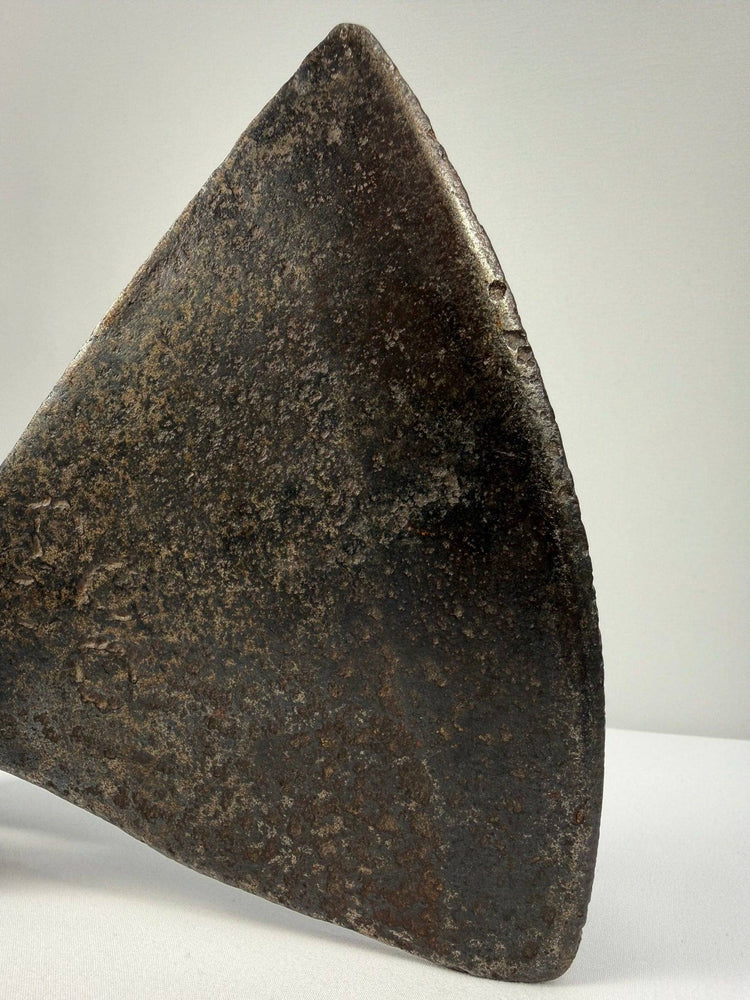 European or Colonial American axe head from the 18th century with broad cutting blade