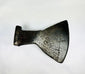 Historic cast iron axe head with triangular socket and oxidation details.