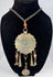 Tribal necklace with turquoise-coloured centre, orange beads, and geometric decoration