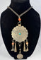 Tribal necklace with turquoise-coloured centre, orange beads, and geometric decoration