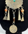 Traditional Afghan jewellery with rosette motif, coloured beads, and aged metal patina
