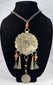 Central Asian tribal jewellery with engraved rosette pendant and suspended metal ornaments