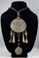 Large scalloped tribal pendant with punched borders and hand-fashioned suspension rings