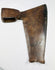 Close-up of rusty forged iron goosewing fishtail axe head with dark brown patina